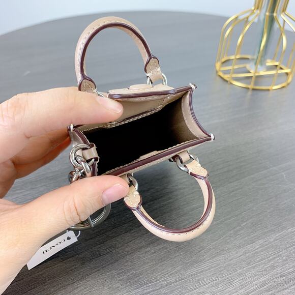 Coach CX069 North/South Mini Tote Bag Charm In Signature Canvas IN Sand Taupe - Picture 5 of 6